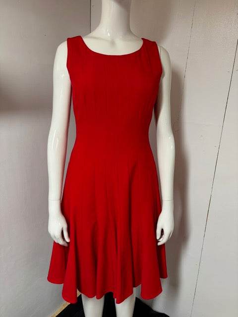 Red sleeveless Calvin Klein dress with minimalist design and bold silhouette