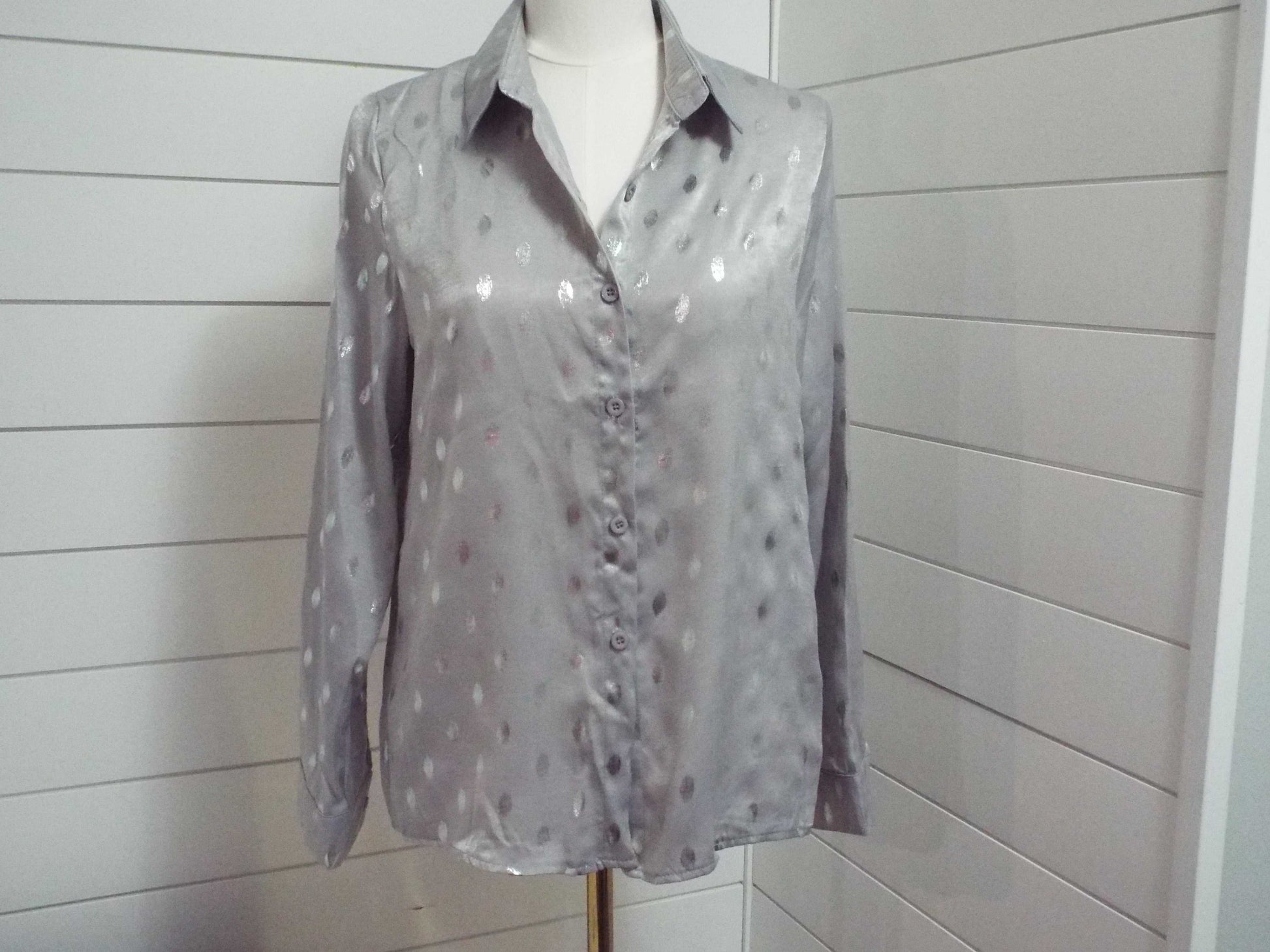 Long sleeve loose bronzing button lapel blouse with relaxed fit and elegant finish