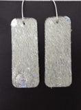 Silver glittery leather earrings made in USA for bold style