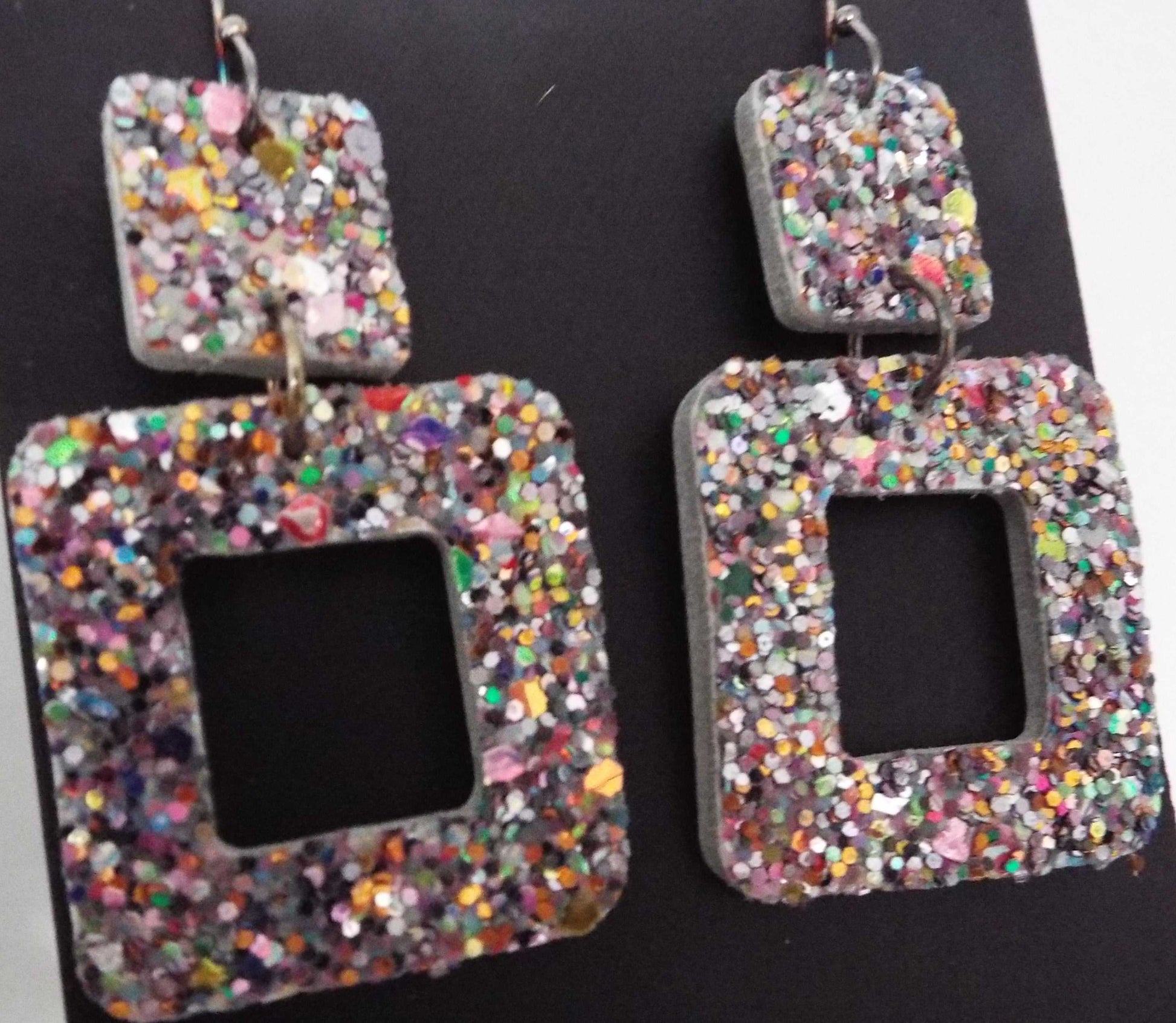 Glitter square leather earrings with geometric design, made in USA, offering lightweight and elegant sparkle