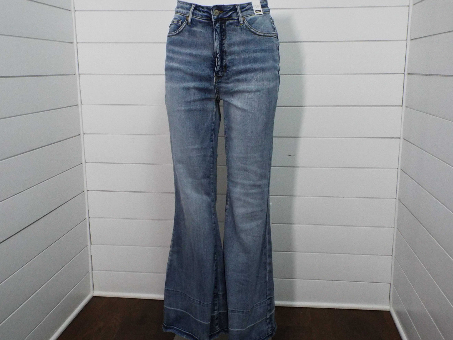 Womens HW Tummy Control medium blue flare pants with built-in tummy support and modern release hem design
