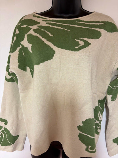 Green floral sweater with vivid botanical prints on rich verdant knit fabric