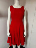 Red sleeveless Calvin Klein dress with minimalist design and bold silhouette