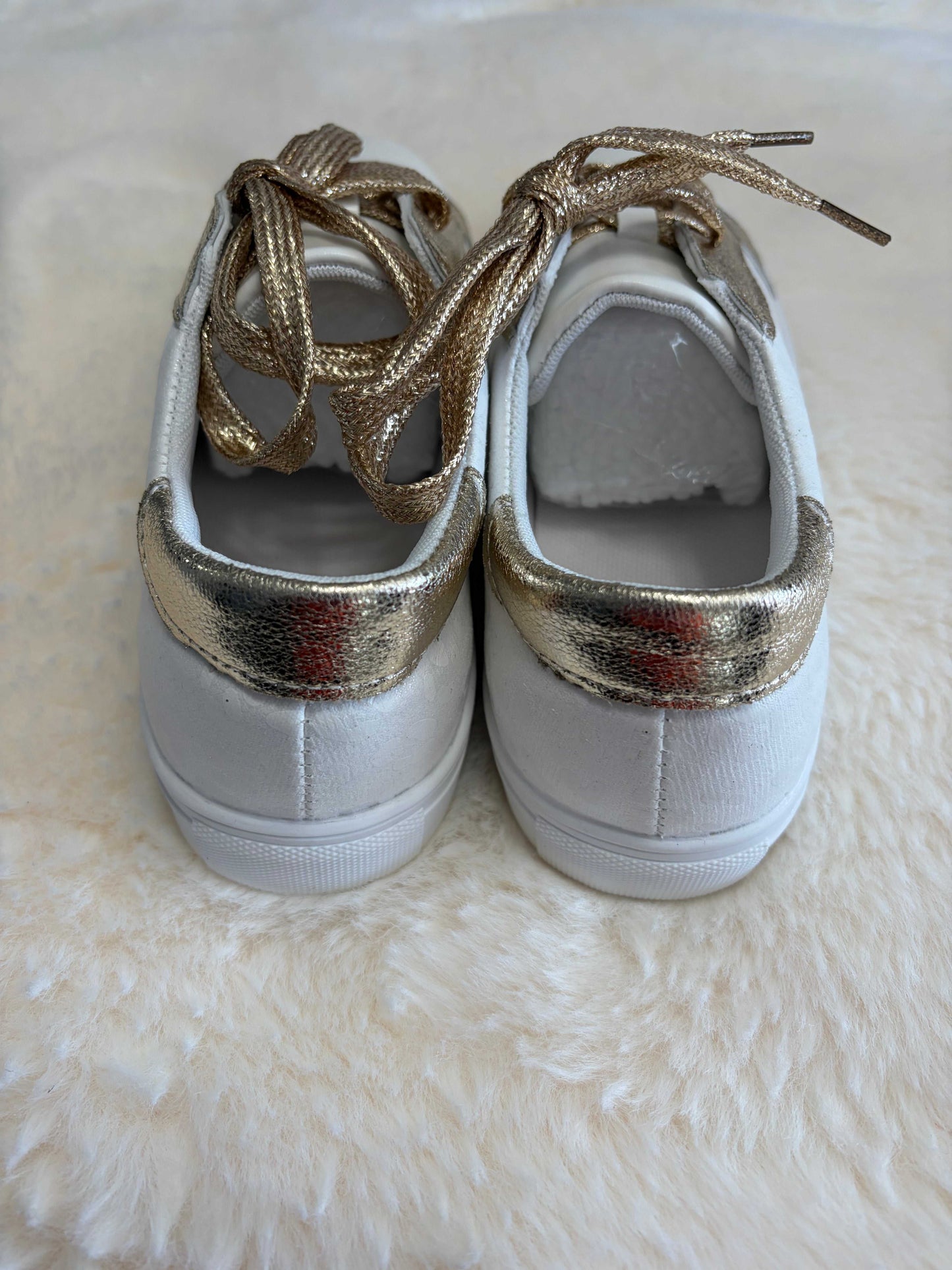 leopard print ladies sneakers with gold-tone accents and leather construction