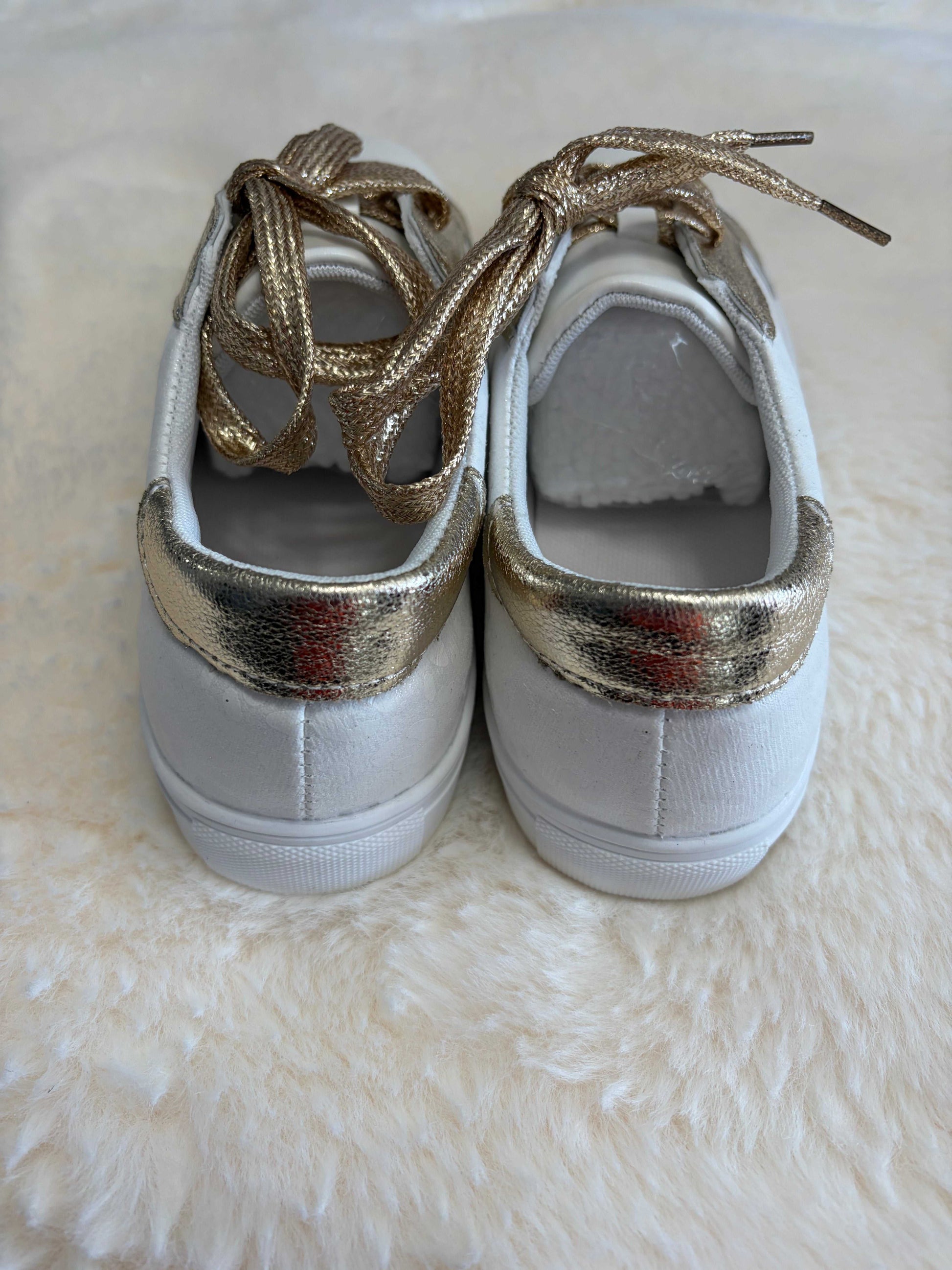 leopard print ladies sneakers with gold-tone accents and leather construction