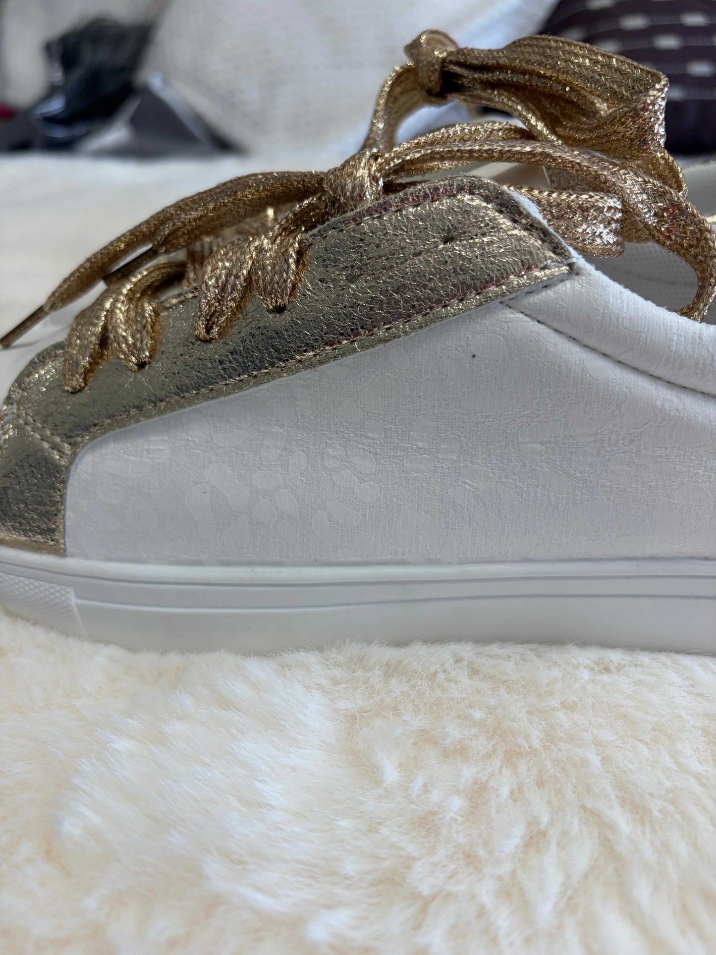 leopard print ladies sneakers with gold-tone accents and leather construction