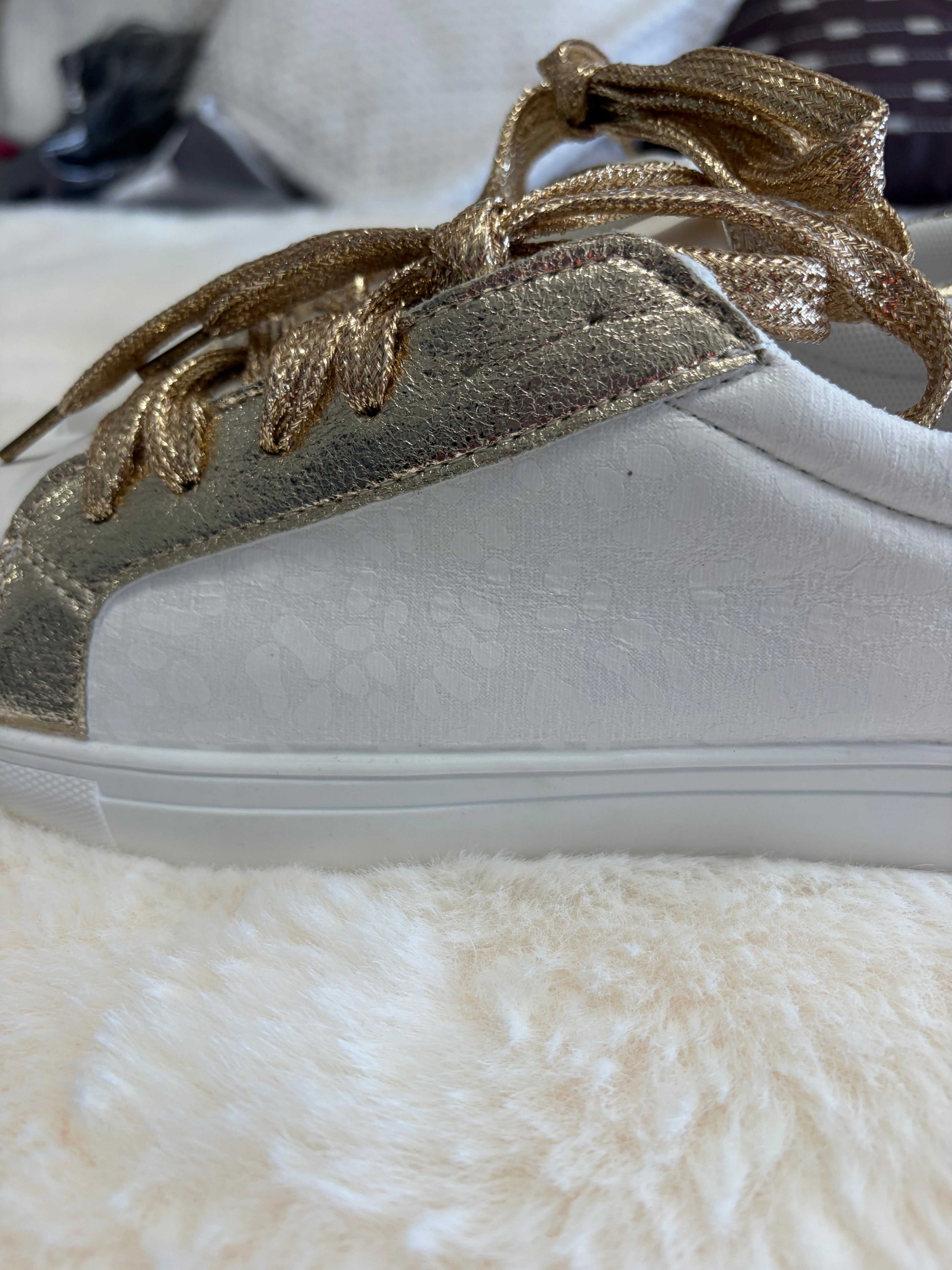 leopard print ladies sneakers with gold-tone accents and leather construction